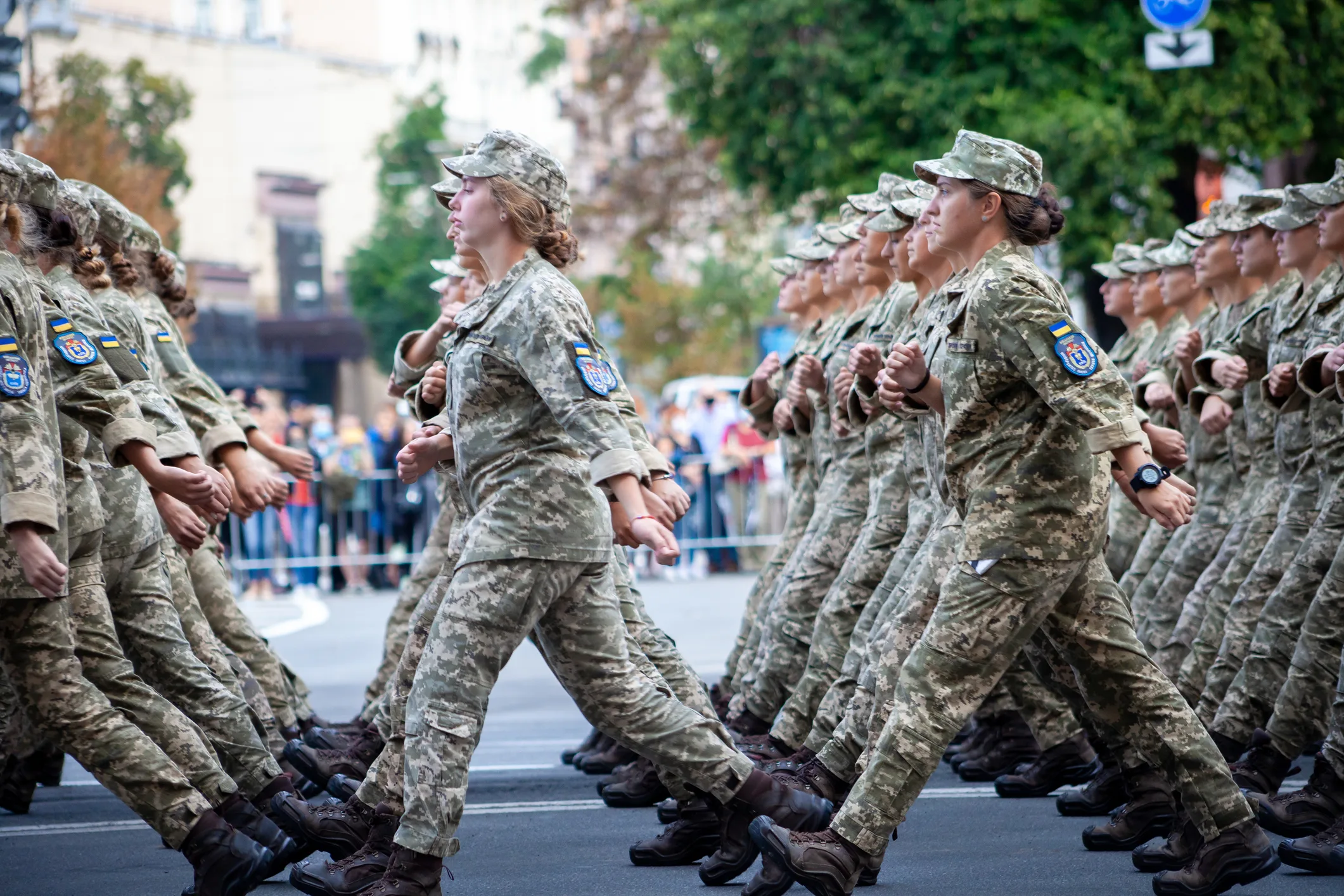 Female Ukrainian soldiers marching in formation, representing the increased role of women in service and society amid the war.