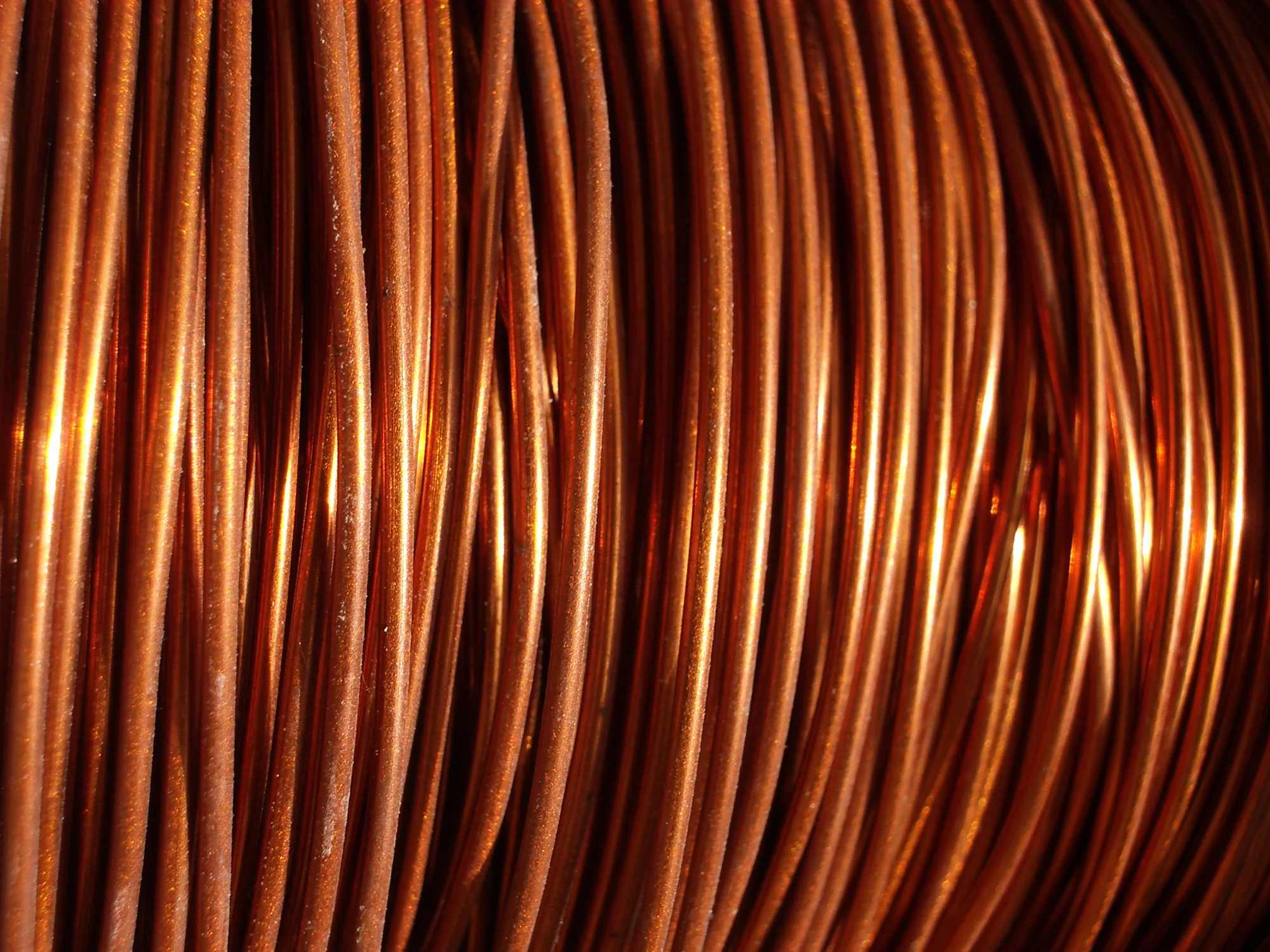 A close-up of a coil of copper wire, representing Mongolia's role as a critical supplier for the global energy transition.
