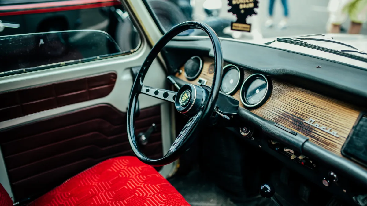 Dashboard of a classic Dacia 1310 car, showing the steering wheel and instrument panel.