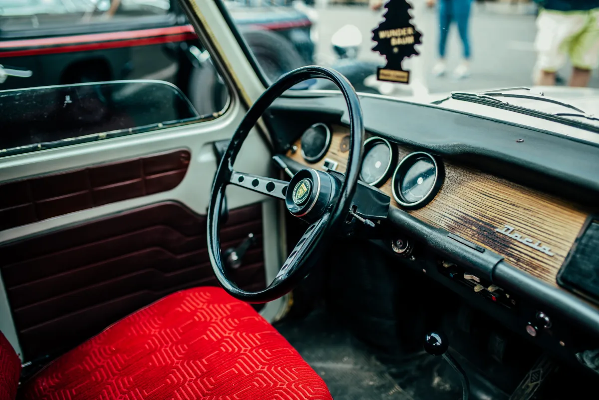 Dashboard of a classic Dacia 1310 car, showing the steering wheel and instrument panel.