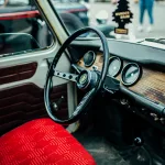 Dashboard of a classic Dacia 1310 car, showing the steering wheel and instrument panel.