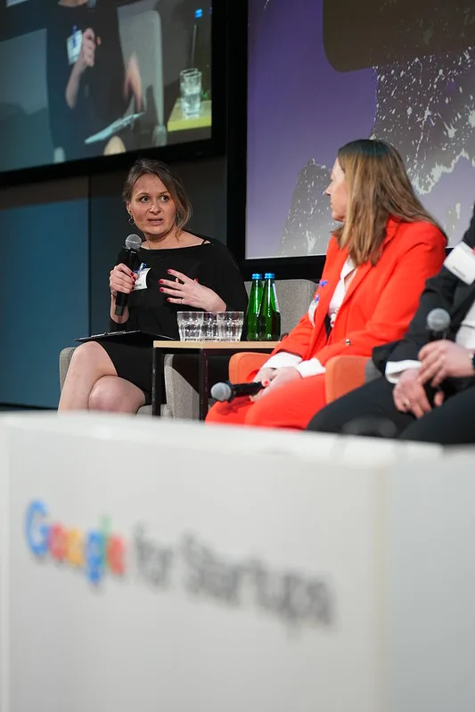 Two women at a tech conference, representing Tech Emerging Europe Advocates and the Global Tech Advocates Launch Pad for innovation.