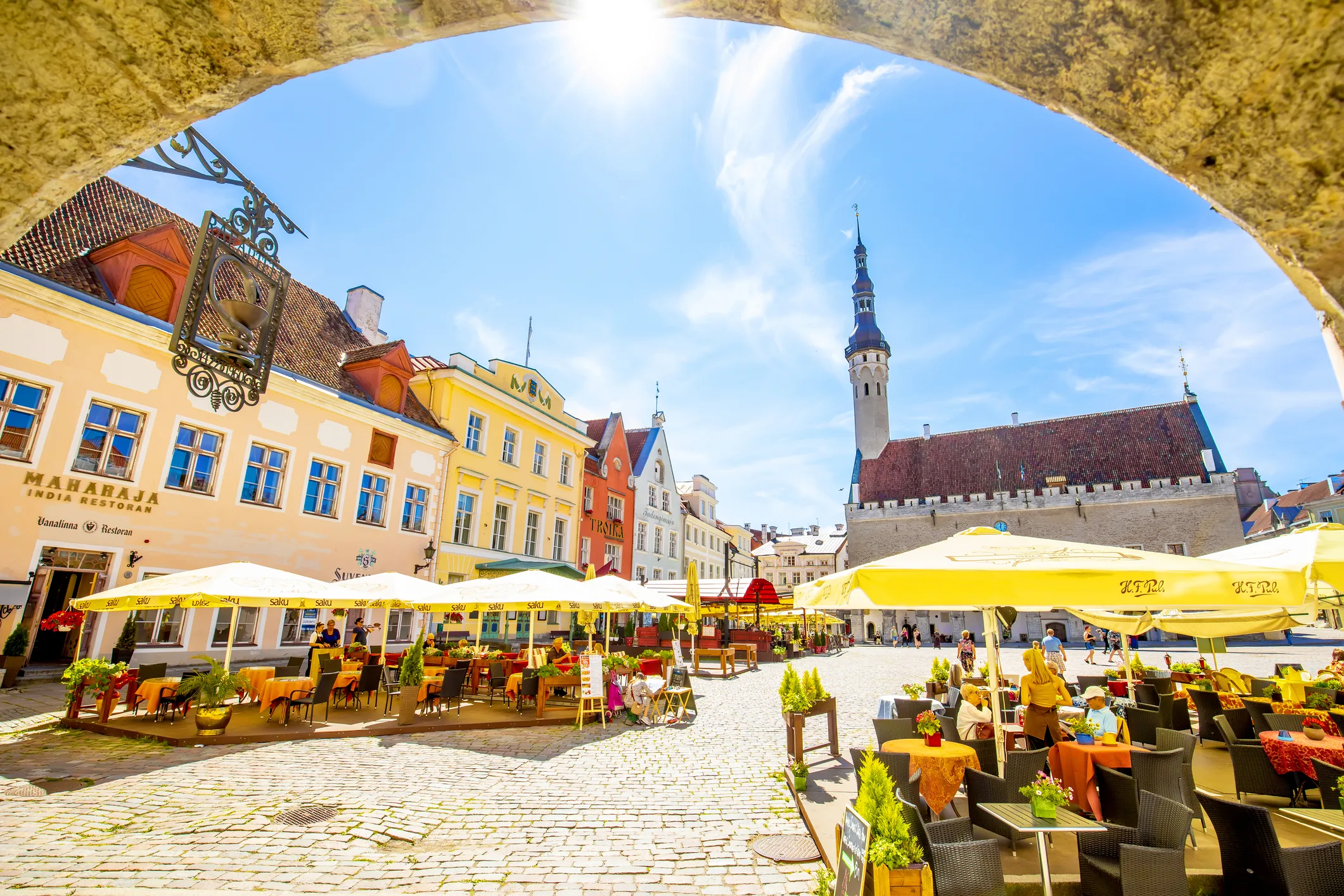 Tallinn’s Town Hall Square on a sunny day, showcasing Estonia’s vibrant Old Town, EU integration, and post-Soviet prosperity in contrast to Russian disinformation narratives