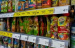 Assortment of baby food pouches and juices on a supermarket shelf in Poland, highlighting everyday consumer goods often excluded from VAT taxation debates in Europe.
