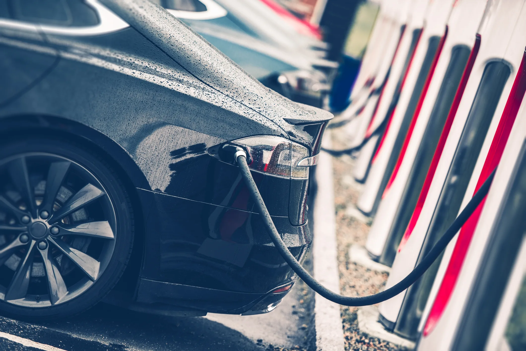 Electric vehicle charging at a station, symbolizing Europe’s rising lithium demand and Central Asia’s role in powering the EV battery supply chain.