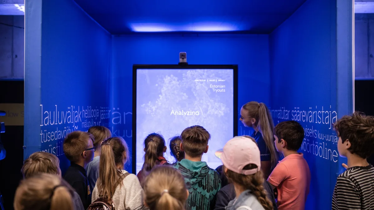 Estonian students at an E-Estonia exhibit learning about digitalisation and the nation’s pioneering digital society.