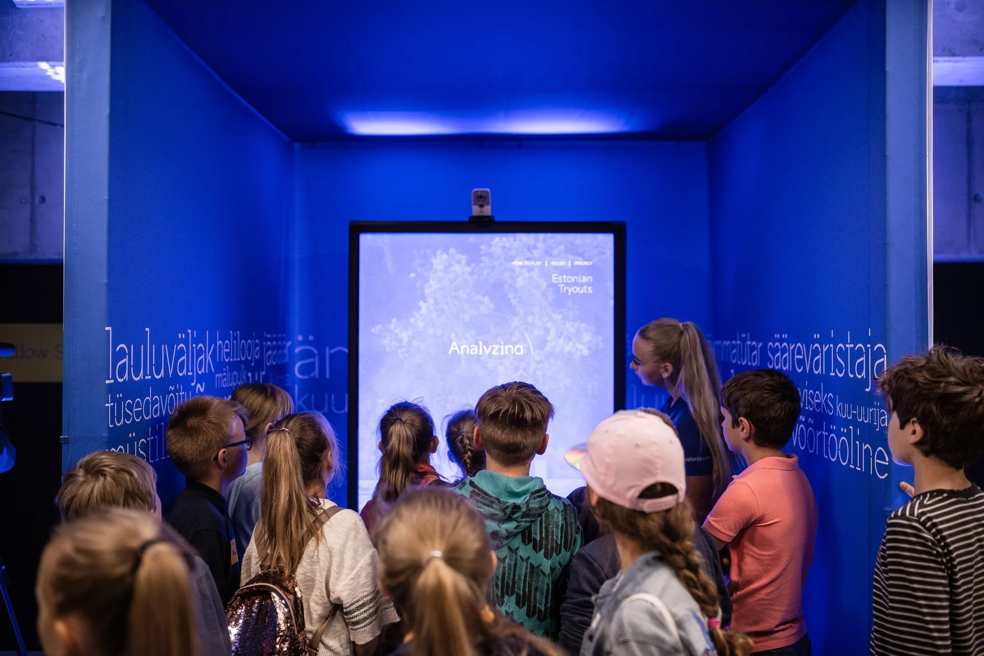Estonian students at an E-Estonia exhibit learning about digitalisation and the nation’s pioneering digital society.